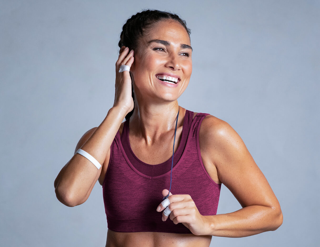 Smiling woman in workout gear after a run
